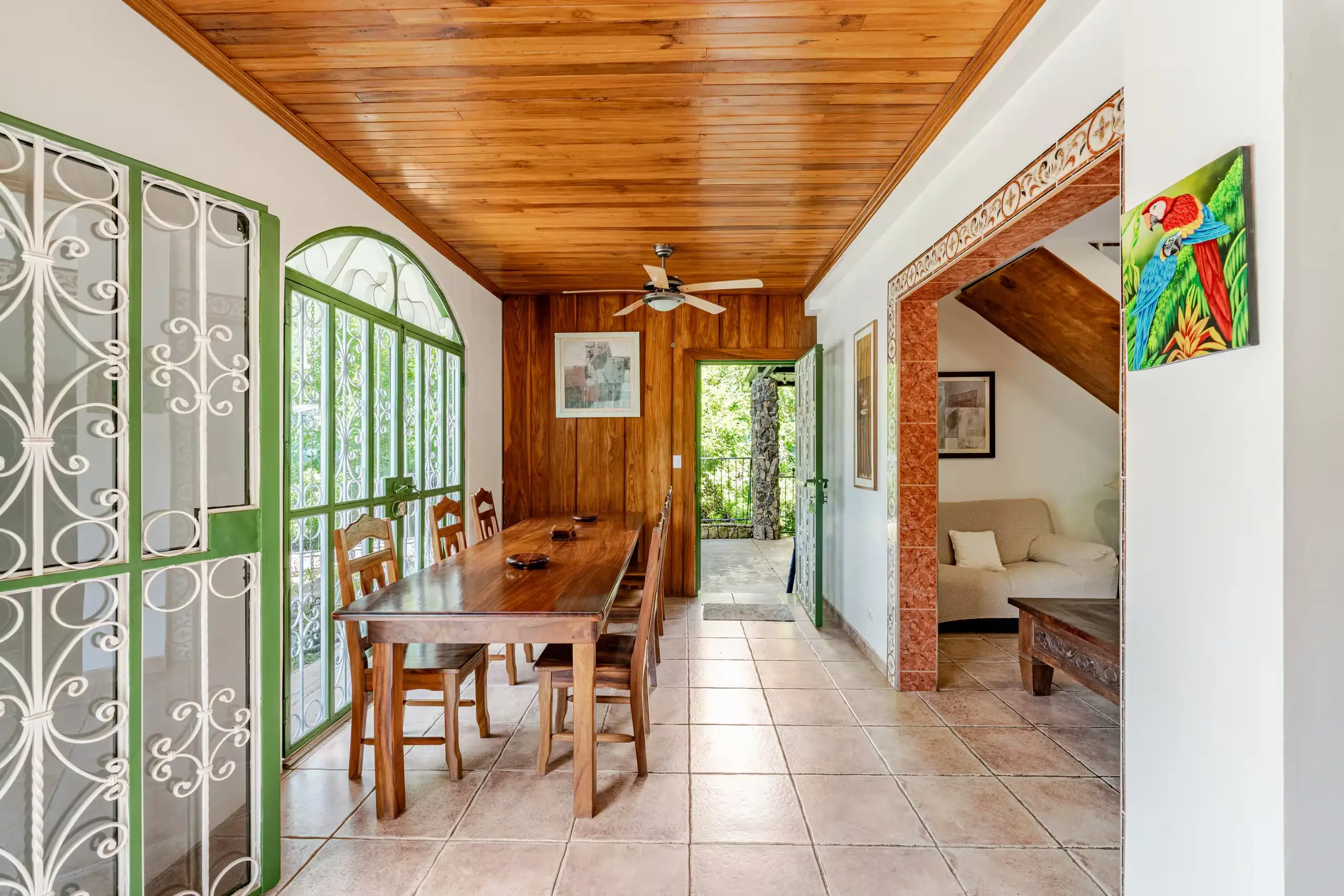 Dining area opening onto the terrace and living room, bringing together indoor comfort and tropical outdoor living.